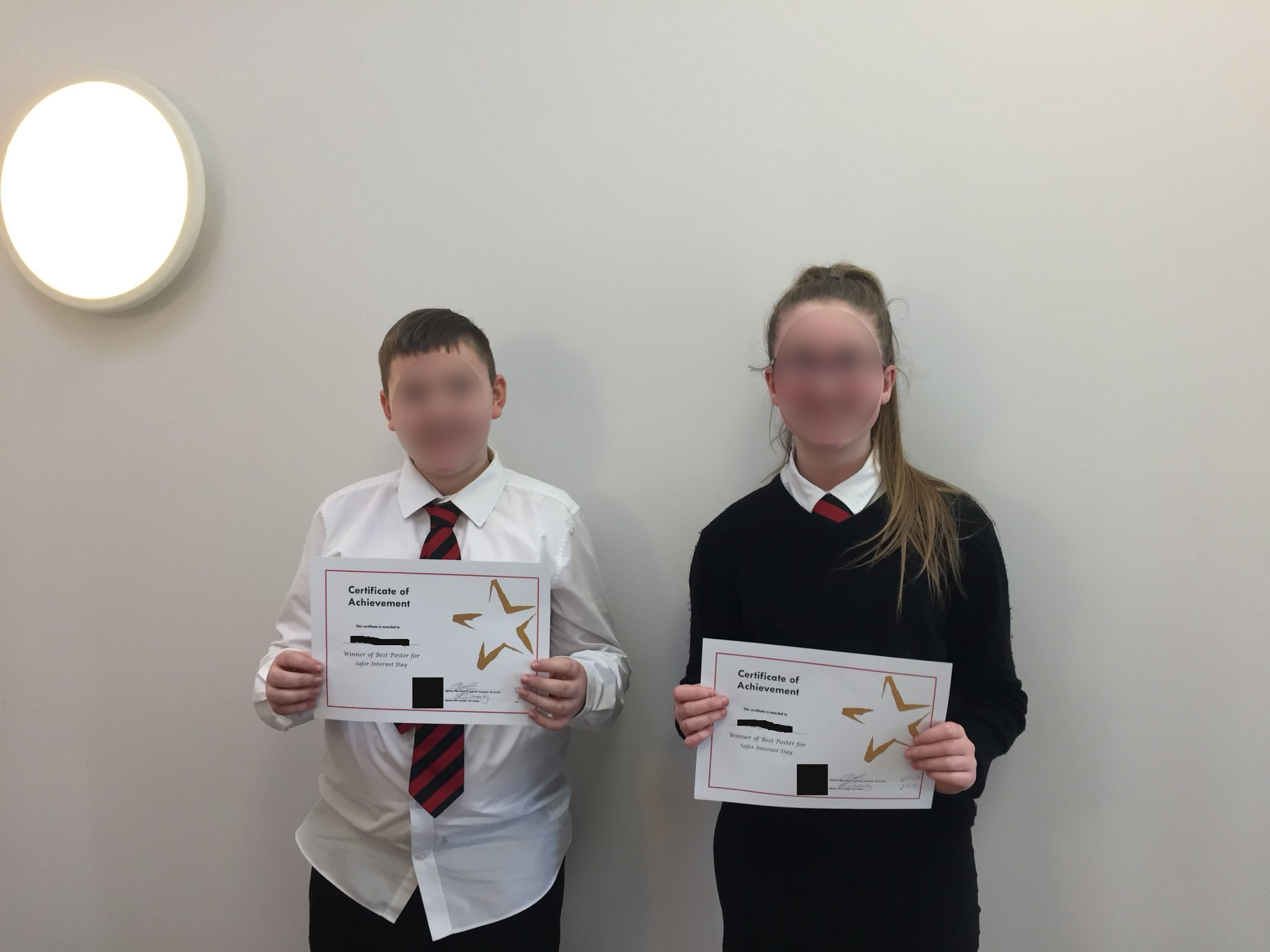 Students holding up certificates for safer internet day